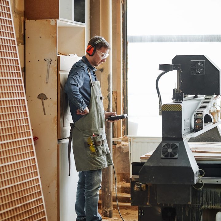 Skilled technician operating a CNC router